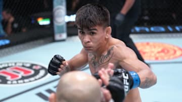 LAS VEGAS, NEVADA - JUNE 25: (R-L) Mario Bautista battles Brian Kelleher in a bantamweight fight during the UFC Fight Night event at UFC APEX on June 25, 2022 in Las Vegas, Nevada. (Photo by Jeff Bottari/Zuffa LLC)