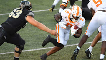 Dec 12, 2020; Nashville, Tennessee, USA; Tennessee Volunteers defensive back Bryce Thompson (0) returns an interception for a touchdown during the first half against the Vanderbilt Commodores at Vanderbilt Stadium. Mandatory Credit: Christopher Hanewinckel-USA TODAY Sports
