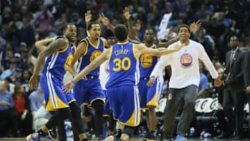 Nov 11, 2015; Memphis, TN, USA; Golden State Warriors Stpehen Curry (30) celebrates with teammates after hitting a three point shot against the Memphis Grizzlies at FedExForum. Golden State defeated Memphis 100-84. Mandatory Credit: Nelson Chenault-USA TODAY Sports