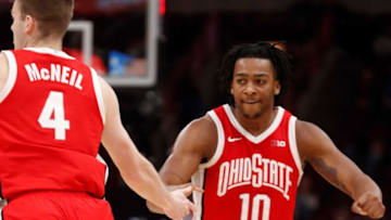 Ohio State Buckeyes guard Sean McNeil (4) high-fives Ohio State Buckeyes forward Brice Sensabaugh (10) during the Big Ten Men’s Basketball Tournament game against the Iowa Hawkeyes, Thursday, March 9, 2023, at United Center in Chicago. Ohio State Buckeyes won 73-69.Osuiowa030923 Am11305