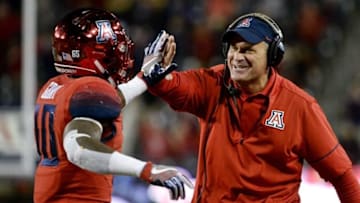Nov 25, 2016; Tucson, AZ, USA; Arizona Wildcats head coach Rich Rodriguez and wide receiver Samajie Grant (10) celebrate after scoring a touchdown against the Arizona State Sun Devils during the fourth quarter of the Territorial Cup at Arizona Stadium. The Wildcats won 56-35. Mandatory Credit: Casey Sapio-USA TODAY Sports