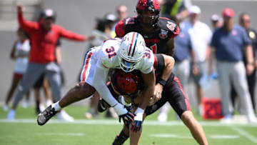 Sep 3, 2022; San Diego, California, USA; San Diego State Aztecs quarterback Braxton Burmeister (5) is pressured by Arizona Wildcats defensive lineman Hunter Echols (31) during the first half at Snapdragon Stadium. Mandatory Credit: Orlando Ramirez-USA TODAY Sports