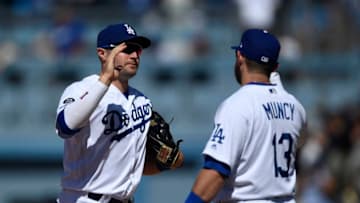 LOS ANGELES, CA - JULY 21: A.J. Pollock #11 of the Los Angeles Dodgers celebrates as he high fives Max Muncy #13 after the Dodgers shut out the Marlins, 9-0, at Dodger Stadium on July 21, 2019 in Los Angeles, California. (Photo by Kevork Djansezian/Getty Images)