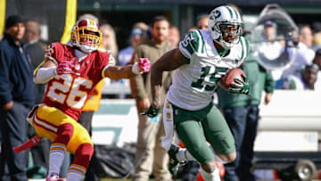 Oct 18, 2015; East Rutherford, NJ, USA; New York Jets wide receiver Brandon Marshall (15) carries the ball past Washington Redskins cornerback Bashaud Breeland (26) in the second half against the Washington Redskins at MetLife Stadium. The Jets won 34-20. Mandatory Credit: Vincent Carchietta-USA TODAY Sports