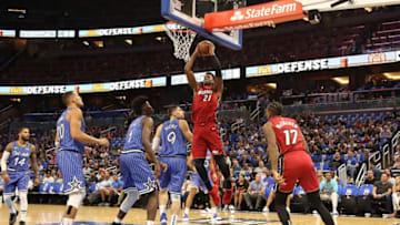 ORLANDO, FL - OCTOBER 17: Hassan Whiteside #21 of the Miami Heat attempts a shot during the game at Amway Center on October 17, 2018 in Orlando, Florida. NOTE TO USER: User expressly acknowledges and agrees that, by downloading and or using this photograph, User is consenting to the terms and conditions of the Getty Images License Agreement. (Photo by Sam Greenwood/Getty Images)