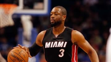 Feb 25, 2015; Orlando, FL, USA; Miami Heat guard Dwyane Wade (3) dribbles the ball against the Orlando Magic during the first quarter at Amway Center. Mandatory Credit: Kim Klement-USA TODAY Sports