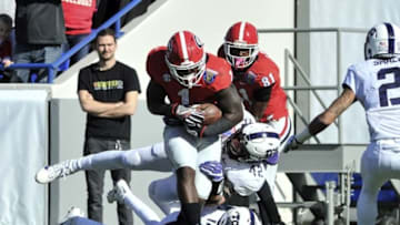 Dec 30, 2016; Memphis, TN, USA; TCU Horned Frogs linebacker Ty Summers (42) and TCU Horned Frogs cornerback Jeff Gladney (12) bring down Georgia Bulldogs running back Sony Michel (1) during the first half at Liberty Bowl. Mandatory Credit: Justin Ford-USA TODAY Sports
