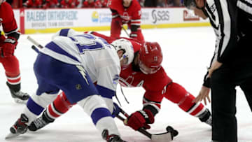 RALEIGH, NC - MARCH 21: RALEIGH, NC - MARCH Jordan Staal #11 of the Carolina Hurricanes faces off against Brayden Point #21 of the Tampa Bay Lightning during an NHL game on March 21, 2019 at PNC Arena in Raleigh, North Carolina. (Photo by Gregg Forwerck/NHLI via Getty Images)