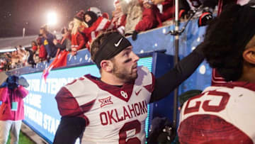 Nov 19, 2016; Morgantown, WV, USA; Oklahoma Sooners quarterback Baker Mayfield (6) celebrates with fans after beating the West Virginia Mountaineers at Milan Puskar Stadium. Mandatory Credit: Ben Queen-USA TODAY Sports