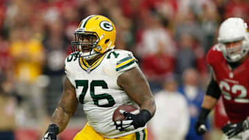 GLENDALE, AZ - DECEMBER 27: Defensive end Mike Daniels #76 of the Green Bay Packers intercepts a pass during the NFL game against the Arizona Cardinals at the University of Phoenix Stadium on December 27, 2015 in Glendale, Arizona. (Photo by Christian Petersen/Getty Images)
