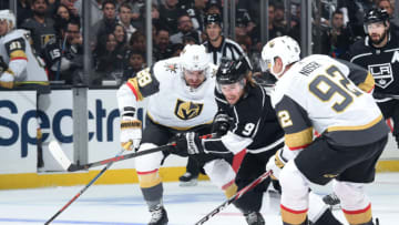 LOS ANGELES, CA - OCTOBER 13: Adrian Kempe #9 of the Los Angeles Kings races for the puck against William Carrier #28 and Tomas Nosek #92 of the Vegas Golden Knights during the first period of the game at STAPLES Center on October 13, 2019 in Los Angeles, California. (Photo by Juan Ocampo/NHLI via Getty Images)