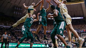 WEST LAFAYETTE, IN - JANUARY 27: Nojel Eastern #20 and Matt Haarms #32 of the Purdue Boilermakers reach for a rebound against Kenny Goins #25 of the Michigan State Spartans at Mackey Arena on January 27, 2019 in West Lafayette, Indiana. (Photo by Michael Hickey/Getty Images)