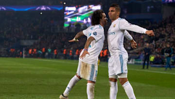 PARIS, FRANCE - MARCH 06: Carlos Casemiro of Real Madrid celebrate with Marcelo Vieira of Real Madrid after scoring his team's second goal during the UEFA Champions League Round of 16 Second Leg match between Paris Saint-Germain and Real Madrid at Parc des Princes on March 6, 2018 in Paris, France. (Photo by Manuel Queimadelos Alonso/Getty Images)