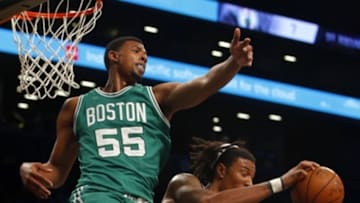 Oct 14, 2015; Brooklyn, NY, USA; Brooklyn Nets forward Justin Harper (35) takes a rebound away fromm Boston Celtics forward Jordan Mickey (55) during second half at Barclays Center. Mandatory Credit: Noah K. Murray-USA TODAY Sports