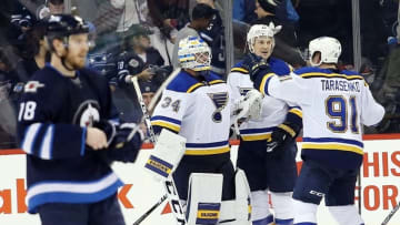 Dec 15, 2015; Winnipeg, Manitoba, CAN; St. Louis Blues goalie Jake Allen (34) celebrates with teammates after the third period against the Winnipeg Jets at MTS Centre. St. Louis Blues wins 4-3. Mandatory Credit: Bruce Fedyck-USA TODAY Sports