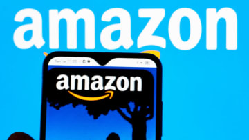 UKRAINE - 2022/01/12: In this photo illustration, the Amazon Books logo is seen displayed on a smartphone screen and the Amazon logo in the background. (Photo Illustration by Igor Golovniov/SOPA Images/LightRocket via Getty Images)