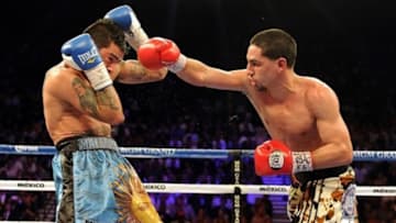 Sep 14, 2013; Las Vegas, NV, USA; Danny Garcia (red gloves) and Lucas Matthysse battle during their during their WBC and WBA super lightweight titles fight at MGM Grand Garden Arena. Mandatory Credit: Jayne Kamin-Oncea-USA TODAY Sports