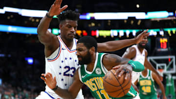 BOSTON, MASSACHUSETTS - DECEMBER 25: Kyrie Irving #11 of the Boston Celtics drives to the basket on Jimmy Butler #23 of the Philadelphia 76ers during the fourth quarter of the game at TD Garden on December 25, 2018 in Boston, Massachusetts. NOTE TO USER: User expressly acknowledges and agrees that, by downloading and or using this photograph, User is consenting to the terms and conditions of the Getty Images License Agreement. (Photo by Omar Rawlings/Getty Images)