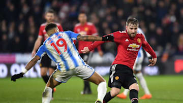 HUDDERSFIELD, ENGLAND - FEBRUARY 17: Danny Williams of Huddersfield Town and Luke Shaw of Manchester United battle for the ball during the The Emirates FA Cup Fifth Round between Huddersfield Town v Manchester United on February 17, 2018 in Huddersfield, United Kingdom. (Photo by Gareth Copley/Getty Images)