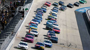DOVER, DE - OCTOBER 01: Brad Keselowski, driver of the #2 Miller Lite Ford, leads the field during the Monster Energy NASCAR Cup Series Apache Warrior 400 presented by Lucas Oil at Dover International Speedway on October 1, 2017 in Dover, Delaware. (Photo by Brian Lawdermilk/Getty Images)