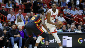 Apr 11, 2023; Miami, Florida, USA; Miami Heat center Bam Adebayo (13) protects the ball from Atlanta Hawks center Clint Capela (15) during the third quarter at Kaseya Center. Mandatory Credit: Sam Navarro-USA TODAY Sports