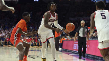 Nov 6, 2023; Tucson, Arizona, USA; Arizona Wildcats guard Caleb Love (2) makes a pass to guard KJ Lewis (5) against Morgan State Bears guard Ahmarie Simpkins (11) during the second half at McKale Center. Mandatory Credit: Zachary BonDurant-USA TODAY Sports