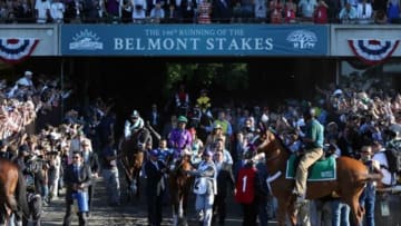 Jun 7, 2014; Elmont, NY, USA; Victor Espinoza aboard California Chrome (2) is led out before the start of the 2014 Belmont Stakes at Belmont Park. Mandatory Credit: Brian Spurlock-USA TODAY Sports
