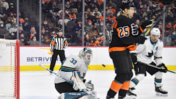 Jan 8, 2022; Philadelphia, Pennsylvania, USA; Philadelphia Flyers left wing James van Riemsdyk (25) screens San Jose Sharks goaltender Adin Hill (33) as he makes a save during the second period at Wells Fargo Center. Mandatory Credit: Eric Hartline-USA TODAY Sports