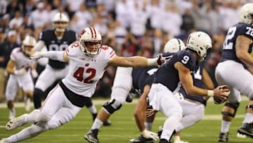 Dec 3, 2016; Indianapolis, IN, USA; Penn State Nittany Lions quarterback Trace McSorley (9) is pressured by Wisconsin Badgers linebacker T.J. Watt (42) in the first half during the Big Ten Championship college football game at Lucas Oil Stadium. Mandatory Credit: Thomas J. Russo-USA TODAY Sports
