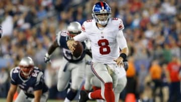 Aug 29, 2013; Foxborough, MA, USA; New York Giants quarterback David Carr (8) runs the ball against the New England Patriots in the second quarter at Gillette Stadium. Mandatory Credit: David Butler II-USA TODAY Sports