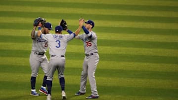 PHOENIX, ARIZONA - JUNE 04: Outfielders Alex Verdugo #27, Chris Taylor #3 and Cody Bellinger #35 of the Los Angeles Dodgers celebrate after defeating the Arizona Diamondbacks in the MLB game at Chase Field on June 04, 2019 in Phoenix, Arizona. The Dodgers defeated the Diamondbacks 9-0. (Photo by Christian Petersen/Getty Images)