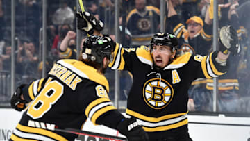May 21, 2021; Boston, Massachusetts, USA; Boston Bruins center Brad Marchand (63) reacts on a goal by right wing David Pastrnak (88) during the second period in game four of the first round of the 2021 Stanley Cup Playoffs against the Washington Capitals at TD Garden. Mandatory Credit: Bob DeChiara-USA TODAY Sports