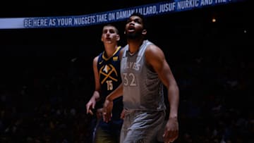 DENVER, CO - APRIL 5: Karl-Anthony Towns #32 of the Minnesota Timberwolves boxes out against Nikola Jokic #15 of the Denver Nuggets on April 5, 2018 at the Pepsi Center in Denver, Colorado. NOTE TO USER: User expressly acknowledges and agrees that, by downloading and/or using this Photograph, user is consenting to the terms and conditions of the Getty Images License Agreement. Mandatory Copyright Notice: Copyright 2018 NBAE (Photo by Bart Young/NBAE via Getty Images)