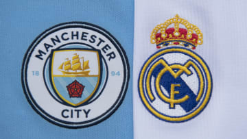 MANCHESTER, ENGLAND - JULY 19: The Manchester City and Real Madrid club crests on the first team home shirts on July 19, 2020 in Manchester, United Kingdom. (Photo by Visionhaus)