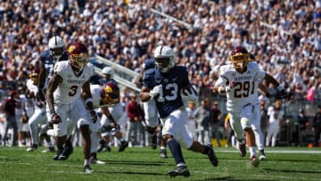 STATE COLLEGE, PA - SEPTEMBER 24: Running back Kaytron Allen #13 of the Penn State Nittany Lions scores a touchdown in front of defensive back Trey Jones #3 and defensive back Jayden Davis #29 of the Central Michigan Chippewas during the first half at Beaver Stadium on September 24, 2022 in State College, Pennsylvania. (Photo by Scott Taetsch/Getty Images)