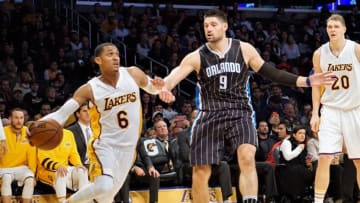 LOS ANGELES, USA - JANUARY 08 : Jordan Clarkson (L) of Los Angeles Lakers in action against Nikola Vucevic (C) of Orlando Magic during a NBA game between Los Angeles Lakers and Orlando Magic at Staples Center in Los Angeles, USA on January 08, 2017. (Photo by Mintaha Neslihan Eroglu/Anadolu Agency/Getty Images)