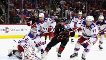 RALEIGH, NORTH CAROLINA - MAY 26: Igor Shesterkin #31 of the New York Rangers sweeps aside a second period shot against the Carolina Hurricanes in Game Five of the Second Round of the 2022 Stanley Cup Playoffs at PNC Arena on May 26, 2022 in Raleigh, North Carolina. (Photo by Bruce Bennett/Getty Images)