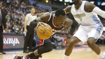 Mar 11, 2015; Denver, CO, USA; Atlanta Hawks guard Dennis Schroder (17) drives to the basket during the first half against the Denver Nuggets at Pepsi Center. Mandatory Credit: Chris Humphreys-USA TODAY Sports