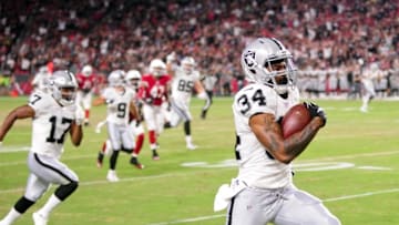 Aug 12, 2016; Glendale, AZ, USA; Oakland Raiders running back George Atkinson (34) runs for a 53 yard touchdown during the second half against the Arizona Cardinals at University of Phoenix Stadium. Mandatory Credit: Matt Kartozian-USA TODAY Sports