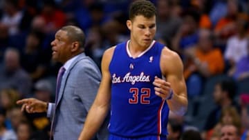 Mar 4, 2014; Phoenix, AZ, USA; Los Angeles Clippers forward Blake Griffin (right) and head coach Doc Rivers against the Phoenix Suns at the US Airways Center. The Clippers defeated the Suns 104-96. Mandatory Credit: Mark J. Rebilas-USA TODAY Sports