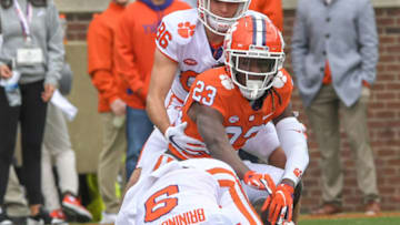 Apr 9, 2022; Clemson, South Carolina, USA; Orange squad cornerback Toriano Pride Jr. (23) gets up after tackling White squad tight end Jake Briningstool (9) during the first quarter of the 2022 Orange vs White Spring Game at Memorial Stadium. Mandatory Credit: Ken Ruinard-USA TODAY Sports
