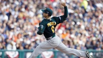 Oct 7, 2013; Detroit, MI, USA; Oakland Athletics starting pitcher Jarrod Parker (11) throws a pitch in the first inning against the Detroit Tigers in game three of the American League divisional series playoff baseball game at Comerica Park. Mandatory Credit: Rick Osentoski-USA TODAY Sports