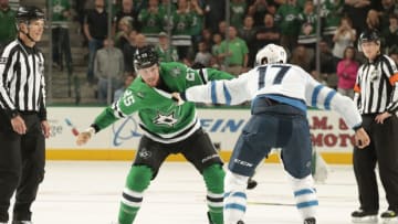 DALLAS, TX - OCTOBER 6: Brett Ritchie #25 of the Dallas Stars squares off against Adam Lowry #17 of the Winnipeg Jets at the American Airlines Center on October 6, 2018 in Dallas, Texas. (Photo by Glenn James/NHLI via Getty Images)