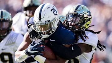 STATE COLLEGE, PA - OCTOBER 05: Noah Cain #21 of the Penn State Nittany Lions is tackled by Cory Trice #23 of the Purdue Boilermakers during the second half at Beaver Stadium on October 5, 2019 in State College, Pennsylvania. (Photo by Scott Taetsch/Getty Images)