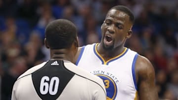 Feb 25, 2016; Orlando, FL, USA; NBA referee James Williams (60) listens to Golden State Warriors forward Draymond Green (23) during the second half of a basketball game at Amway Center. The Warriors won 130-114. Mandatory Credit: Reinhold Matay-USA TODAY Sports