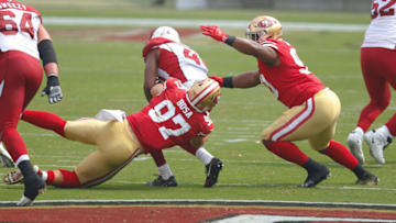 Nick Bosa #97 and Kevin Givens #90 of the San Francisco 49ers tackle Kenyan Drake #41 of the Arizona Cardinals (Photo by Michael Zagaris/San Francisco 49ers/Getty Images)