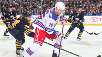 BUFFALO, NY - FEBRUARY 15: Lawrence Pilut #24 of the Buffalo Sabres battles against Ryan Strome #16 of the New York Rangers during an NHL game on February 15, 2019 at KeyBank Center in Buffalo, New York. (Photo by Rob Marczynski/NHLI via Getty Images)
