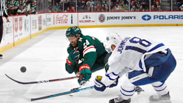 ST. PAUL, MN - DECEMBER 01: Matt Dumba #24 of the Minnesota Wild and Andreas Johnsson #18 of the Toronto Maple Leafs battle for the puck during a game at Xcel Energy Center on December 1, 2018 in St. Paul, Minnesota.(Photo by Bruce Kluckhohn/NHLI via Getty Images)