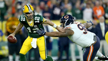 GREEN BAY, WI - SEPTEMBER 09: Aaron Rodgers #12 of the Green Bay Packers avoids being sacked by Akiem Hicks #96 of the Chicago Bears during the first quarter of a game at Lambeau Field on September 9, 2018 in Green Bay, Wisconsin. (Photo by Dylan Buell/Getty Images)