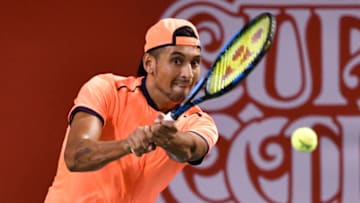 Australia's Nick Kyrgios returns a shot against Belgium's David Goffin during the men's singles final at the ATP Japan Open tennis tournament in Tokyo on October 9, 2016. / AFP / KAZUHIRO NOGI (Photo credit should read KAZUHIRO NOGI/AFP via Getty Images)